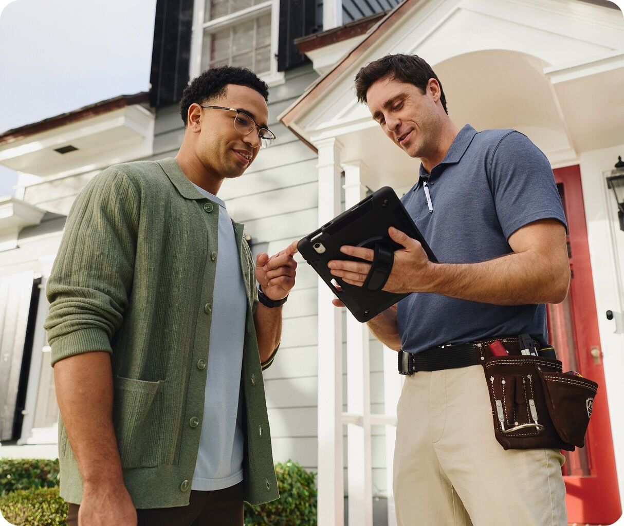 Two people using a tablet