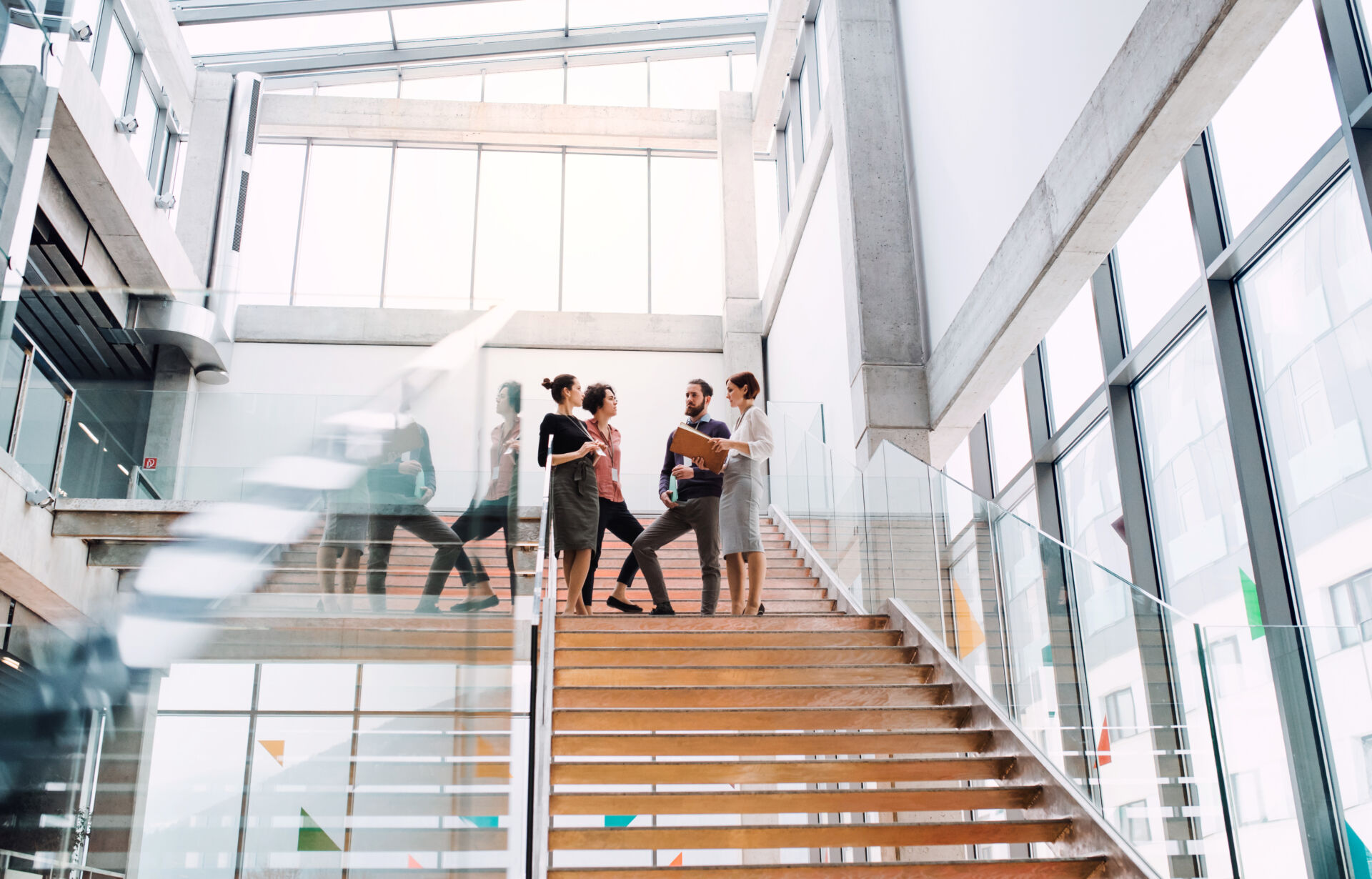 People moving through a modern commercial building where security and operations run on one platform