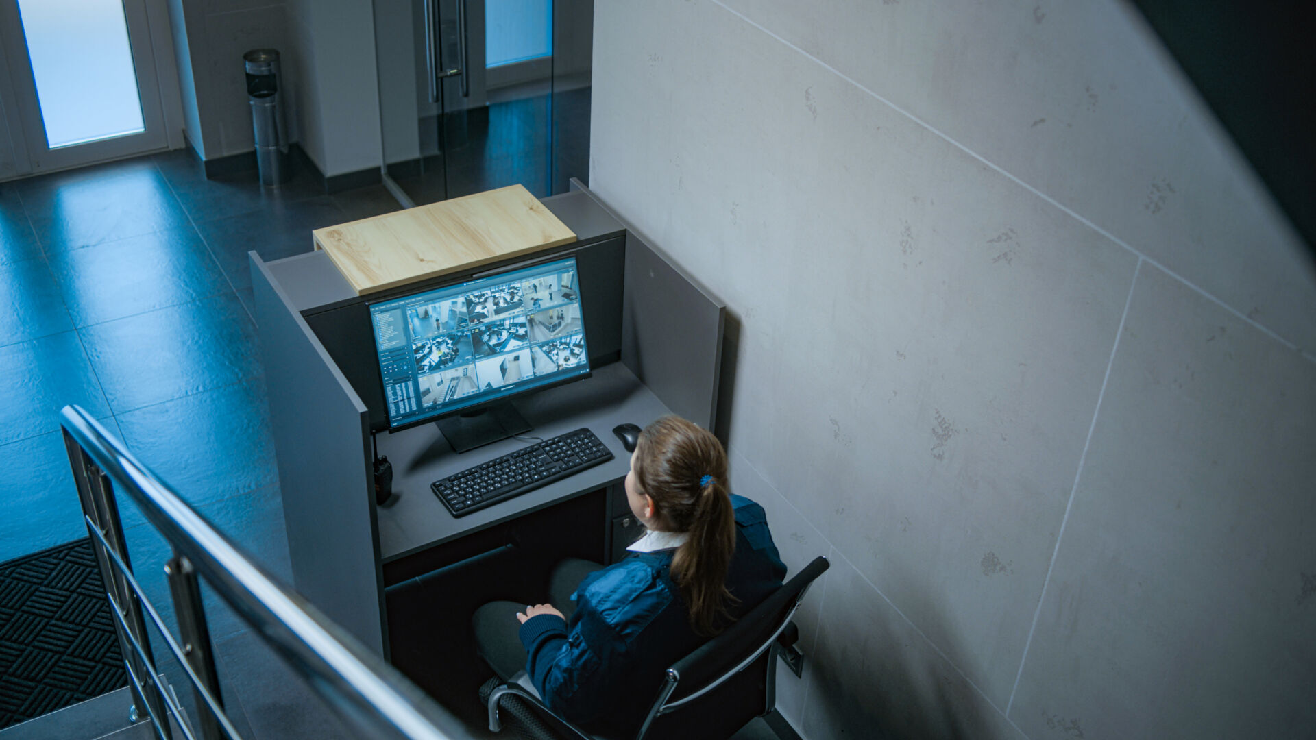 Operator reviewing security footage on a monitor