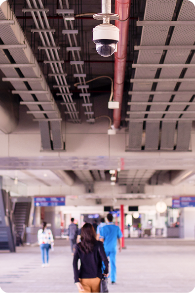Cameras watching people in a large open space
