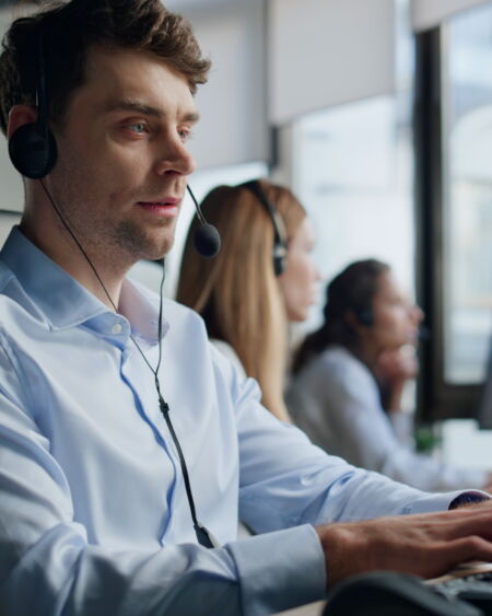 Professional support representative man talking headset helping customer remotely.