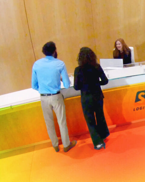 Customers at a retail counter with a heatmap overlay showing high-traffic areas