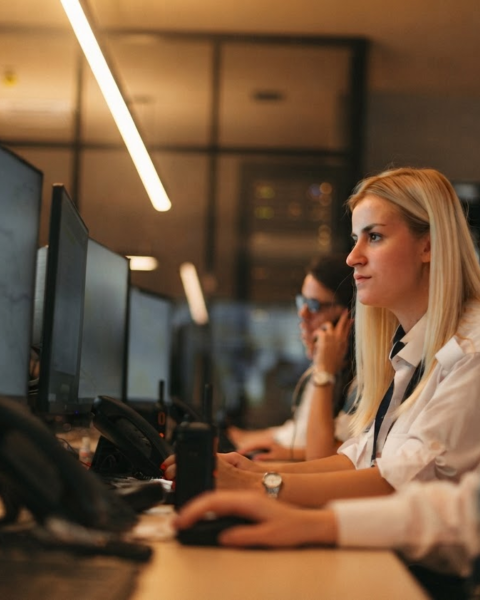 people monitoring computer screens