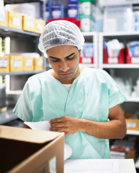 Pharmacy working wearing scrubs