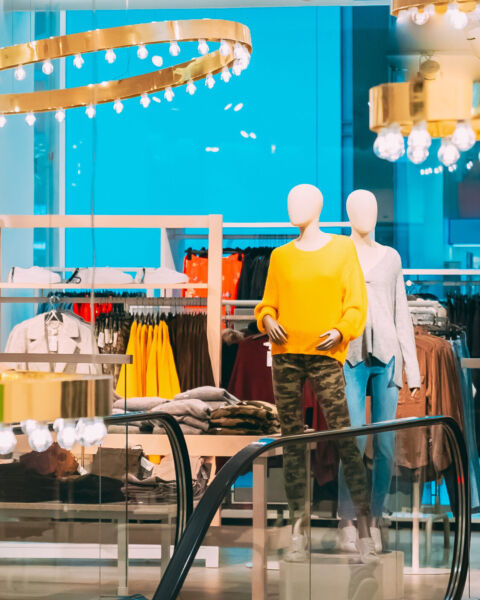 Mannequins Dressed In Female Woman Casual Clothes And Clothes On Shelves And Hanger In Store Of Shopping Center.