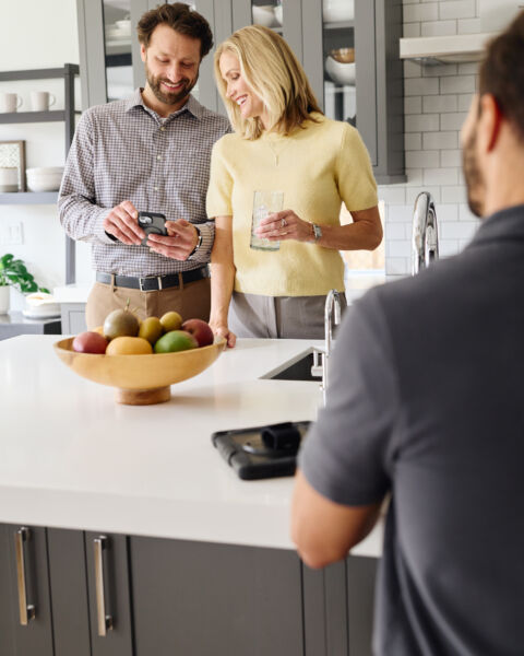 People talking in a kitchen