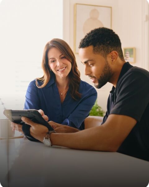 two people on a tablet