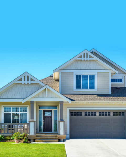 Craftsman-style home exterior with a front door and attached two-car garage