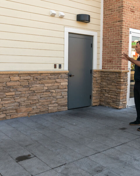 Business owner meeting with a certified Alarm.com service provider on site
