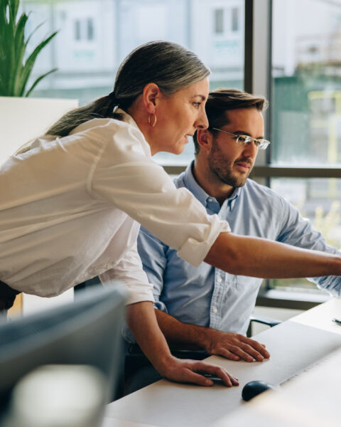 Employee working in an open office protected by commercial intrusion detection