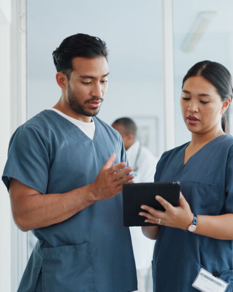 Medical advice, help and doctors with a tablet for healthcare, research and medicine planning. Communication, collaboration and men working in cardiology talking about surgery results on technology.