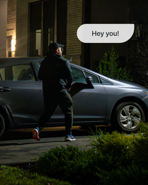 man trying to break into a car