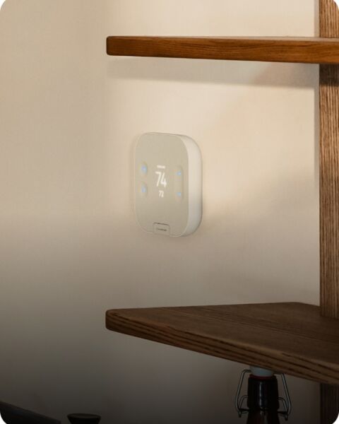 Smart thermostat on wall