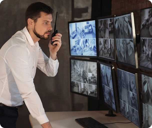 Man looking at computer screens