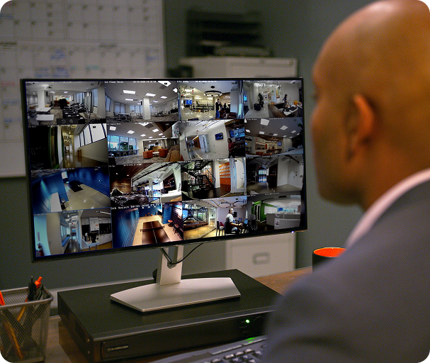 Man using the computer watching camera footage