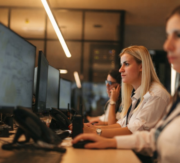 people monitoring computer screens